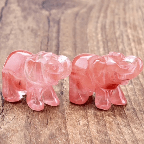 Mini Elephant Crystal Sculpture by MANDOTOS INTERNATIONAL, showcasing a detailed, clear crystal elephant figurine on a white background.