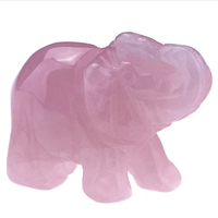 Mini elephant crystal sculpture by MANDOTOS INTERNATIONAL, clear and detailed crystal figurine on a neutral background.
