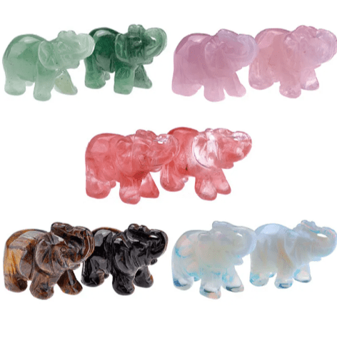 Mini Elephant Crystal Sculpture by MANDOTOS INTERNATIONAL, featuring a detailed clear crystal elephant figurine on a smooth base.