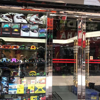 Mandotos International mountain bike goggles and off-road motorcycle sunglasses with tinted lenses and adjustable strap.
