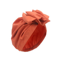 Muslim-style mirror hats and African headgear for women with intricate mirror and bead embellishments, designed by MANDOTOS INTERNATIONAL.