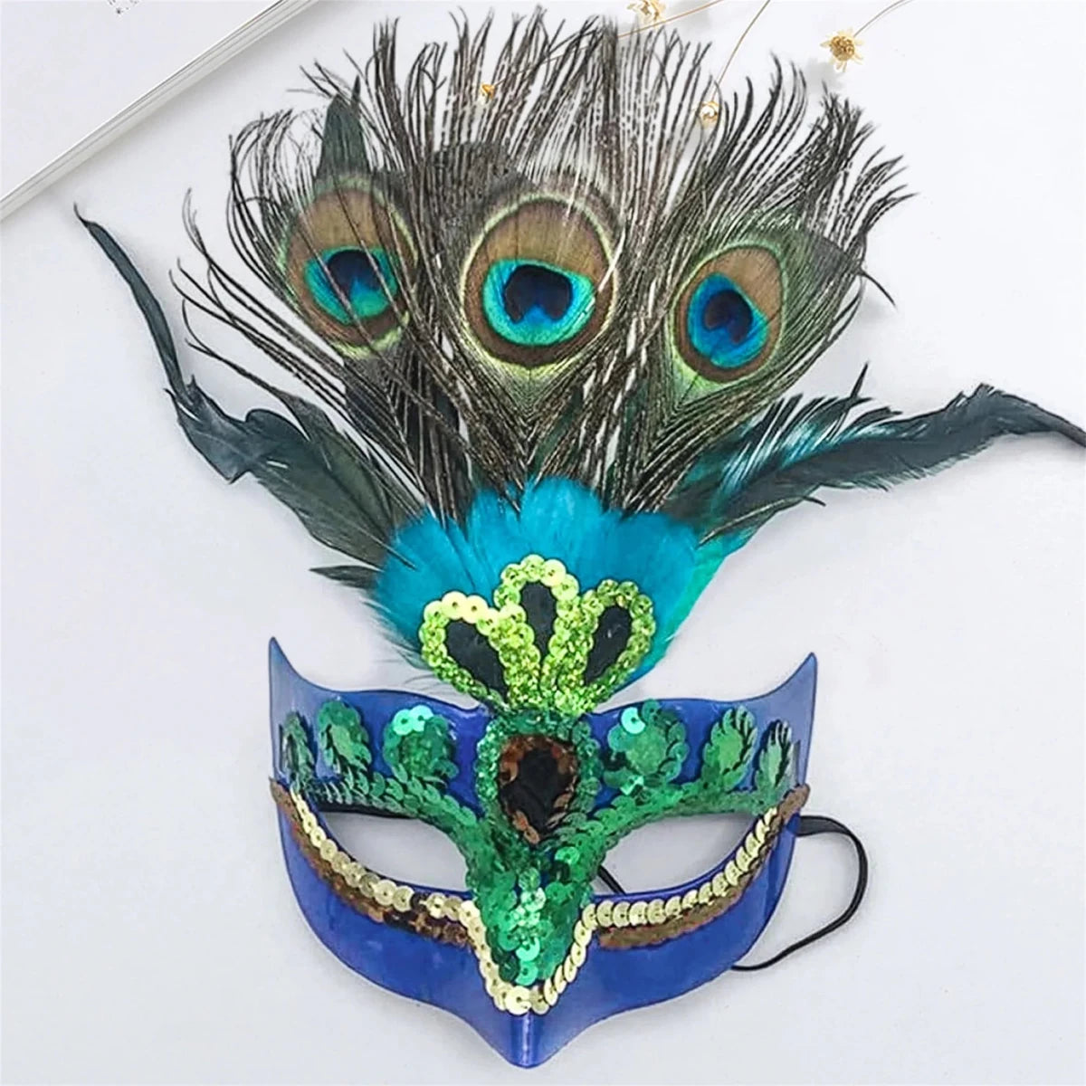 Peacock feather headpiece for women, ideal for Halloween, Mardi Gras, Carnival, and cosplay, by MANDOTOS INTERNATIONAL.