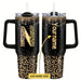 Personalized 40oz steel vacuum tumbler with handle by MANDOTOS INTERNATIONAL, showing a sleek stainless steel design with personalized engraving.