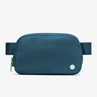 Mandotos International lightweight women’s waist bag for running and travel, compact design, black color, adjustable strap.