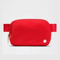 Mandotos International premium lightweight women's waist bag for running and travel, shown in black with adjustable strap.