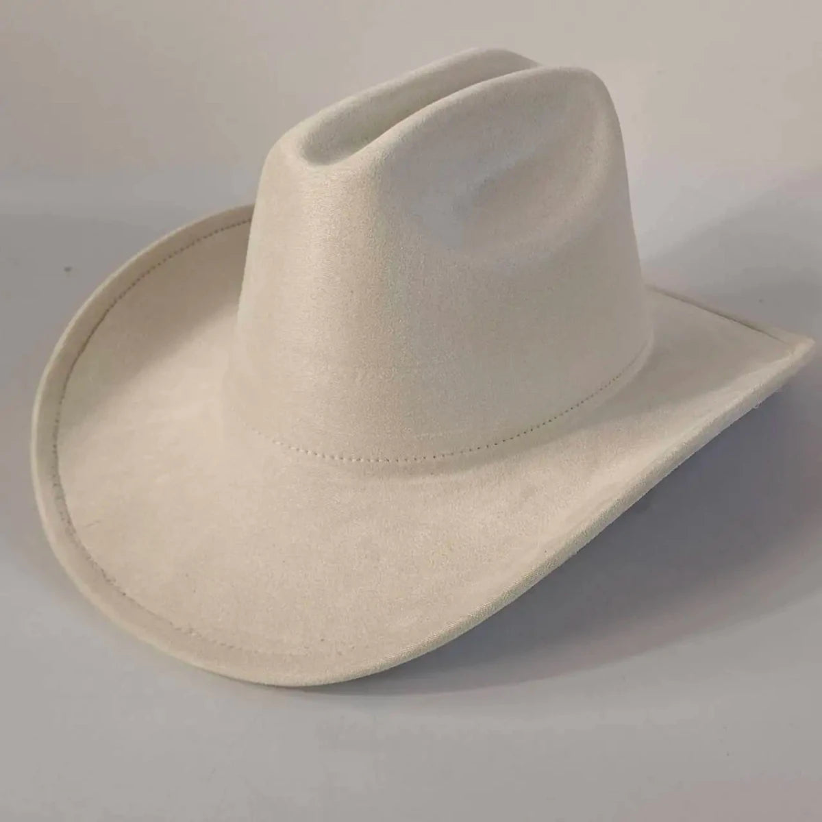 Premium suede cowboy hat by MANDOTOS INTERNATIONAL featuring a wide brim and stylish design for outdoor festivities.