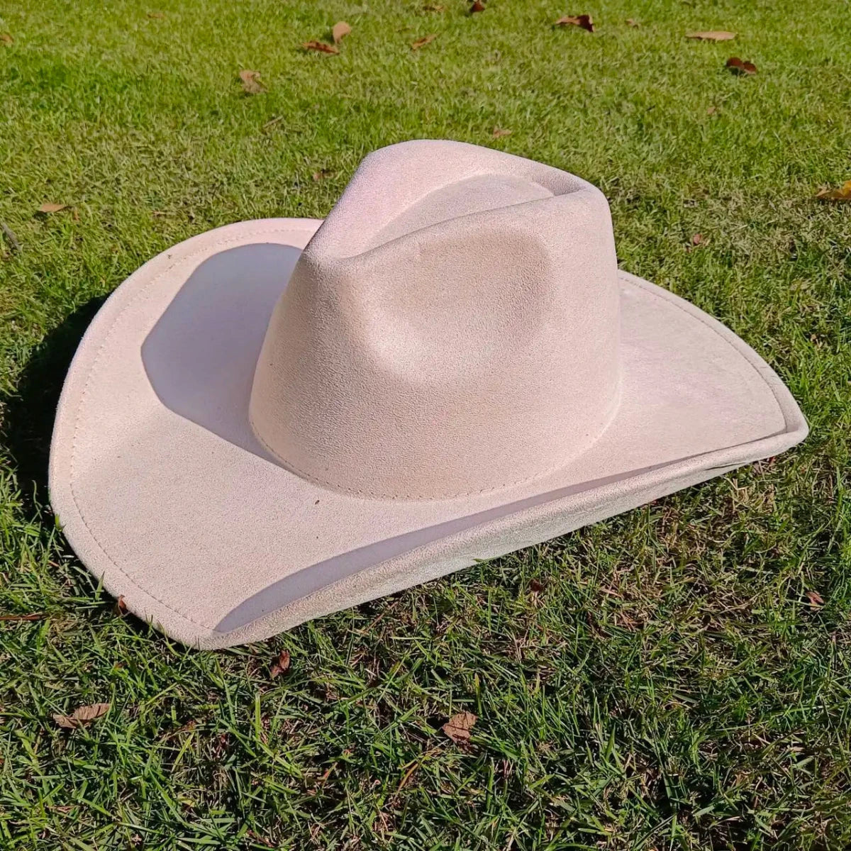 Premium suede cowboy hat by MANDOTOS INTERNATIONAL, stylish men's and women's outdoor hat with wide brim for outdoor festivities.