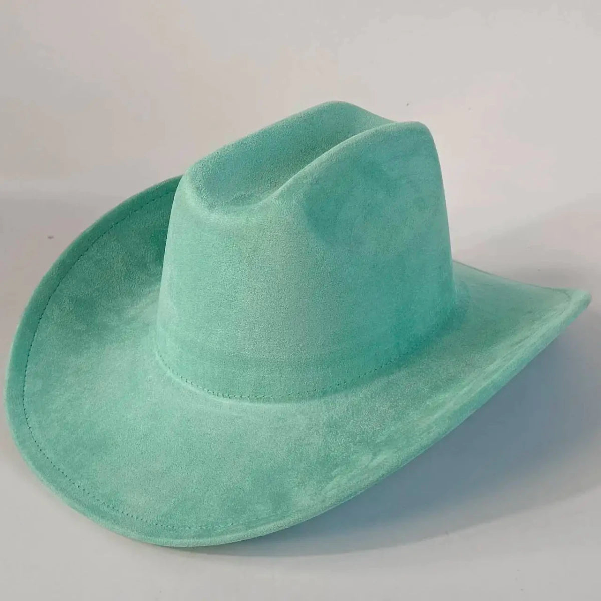 Premium suede cowboy hat by MANDOTOS INTERNATIONAL, stylish outdoor headwear for men and women with a wide brim and classic design.