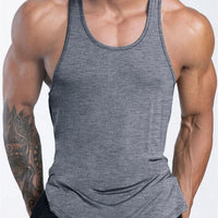 Mandotos International men's quick dry sports tank top for gym, running, and basketball with breathable fabric.