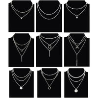 Mandotos International retro geometric pendant necklace featuring bold shapes, perfect for trendy travel dates and stylish accessories.