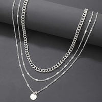 Mandotos International retro geometric pendant necklace with trendy travel-inspired design, featuring bold shapes and modern style.