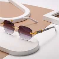 Retro square hip hop sunglasses with gold rimless frames, stylish unisex fashion sunglasses by Mandotos International.