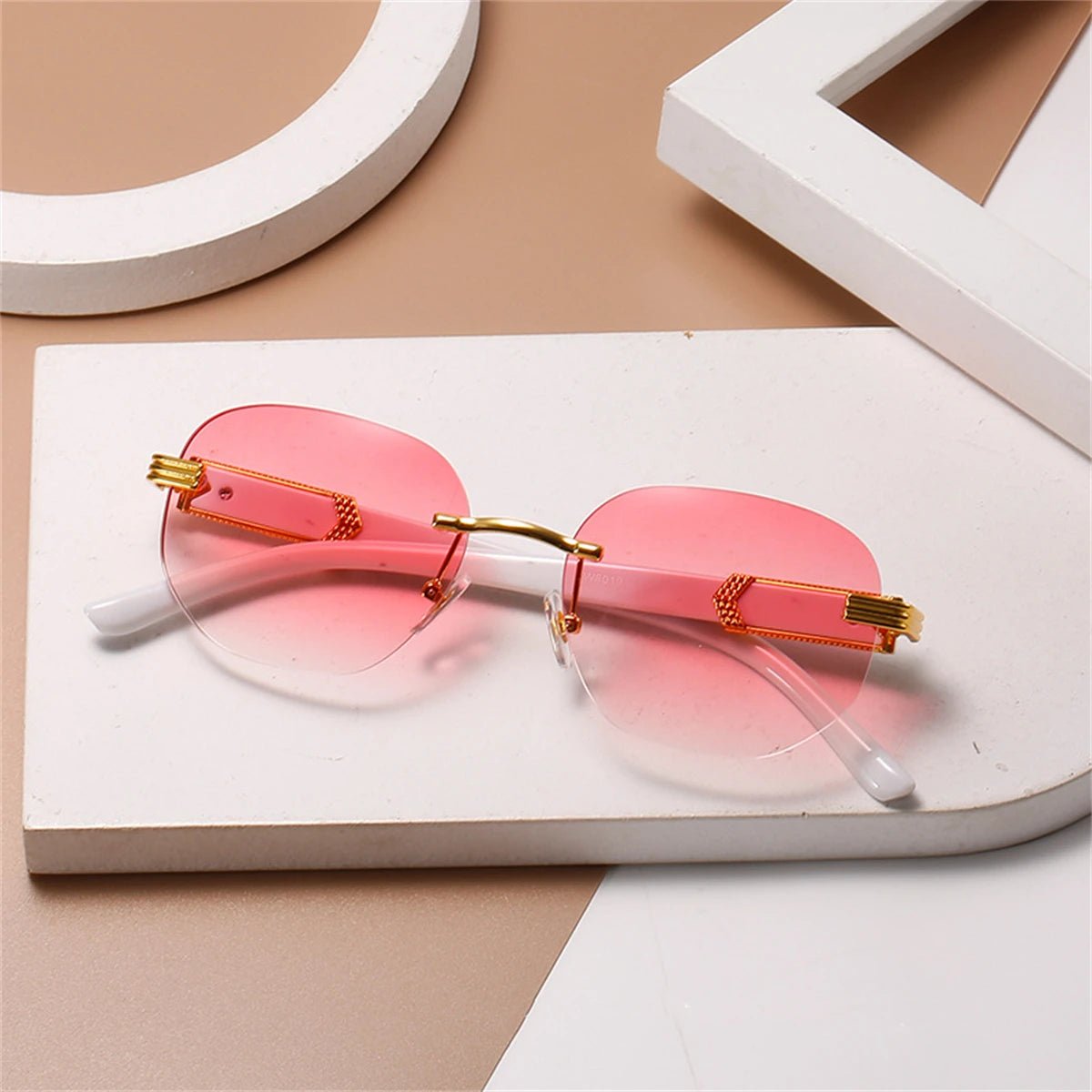 Gold rimless retro square hip hop sunglasses by MANDOTOS INTERNATIONAL for men and women, stylish and fashion-forward.