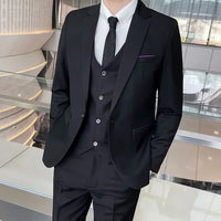 Mandotos International men's formal business suit with blazer, vest, and pants in black, styled for professional or banquet occasions.
