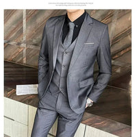 Mandotos International men's formal dress suit with navy blazer, vest, and matching pants, perfect for business or special occasions.