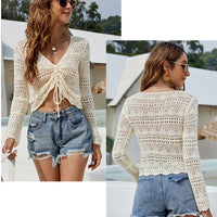 Mandotos International women's long sleeve hollow cutout knit blouse with V-neck and drawstring, casual beach pullover sweater.
