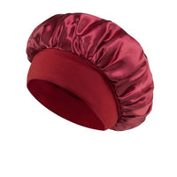 Silk wide-brimmed satin sleep bonnet for women, designed to protect and care for hair overnight, by MANDOTOS INTERNATIONAL.