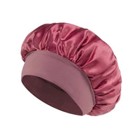 Silk wide-brimmed satin sleeping bonnet for women, designed for hair care and protection during sleep, by MANDOTOS INTERNATIONAL