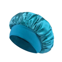 Silk wide-brimmed satin sleeping bonnet for women, designed for hair care and protection during sleep, by MANDOTOS INTERNATIONAL.