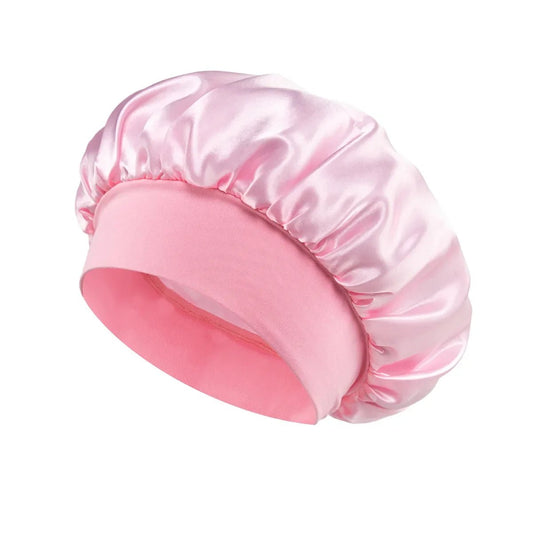 Silk wide-brimmed sleep bonnet for women, satin hair care cap, designed to protect and preserve hair overnight by MANDOTOS INTERNATIONAL.