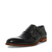 Black Steve Madden Teon monk loafer by Mandotos International, featuring sleek leather design and classic slip-on style.