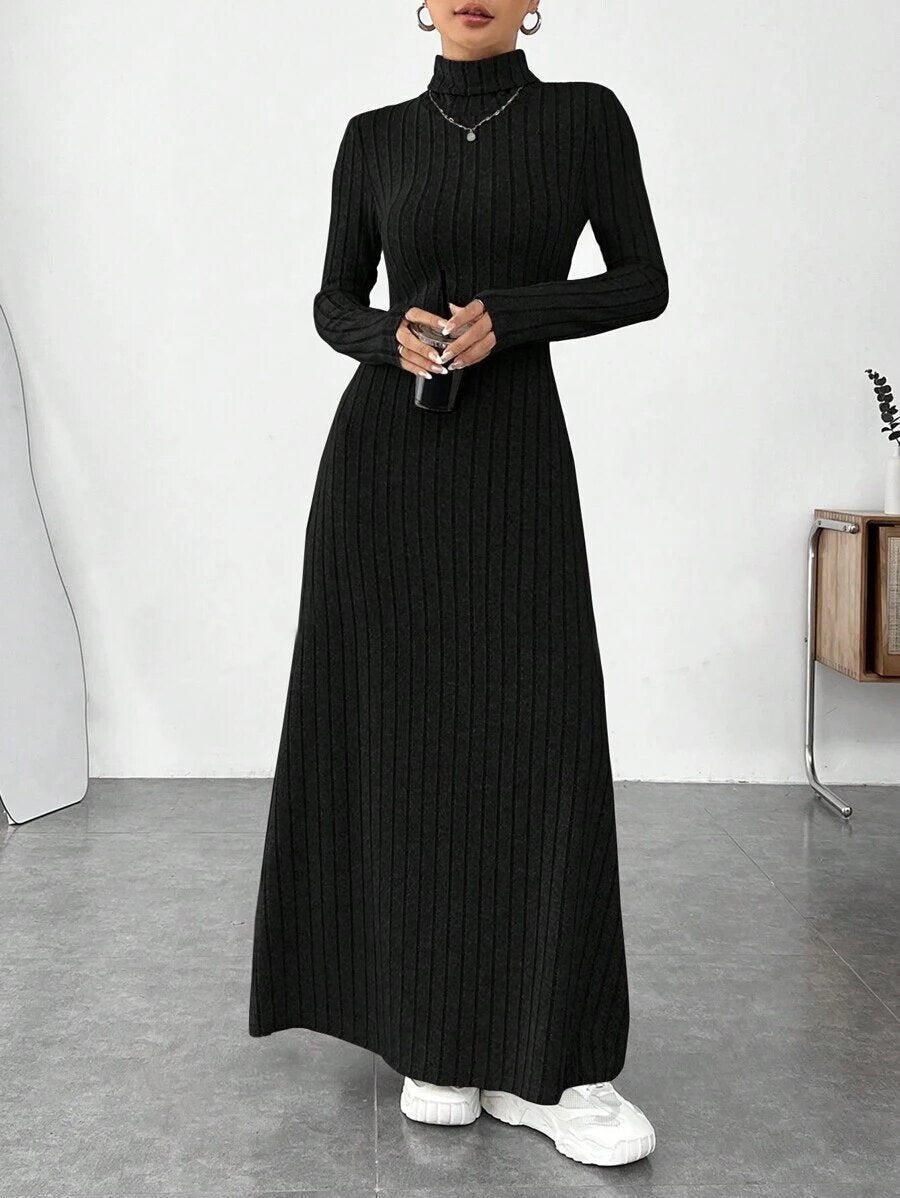 Mandotos International stylish high collar dress from winter fashion collection, featuring a cozy, elegant design with a fitted silhouette.