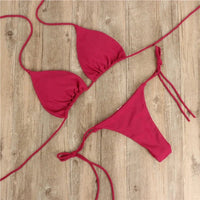 Mandotos International summer solid micro bikini set for women, featuring tie-side G-string thong style and Brazilian bandage design.