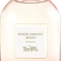Mandotos International Sunset Dreams Coach Perfume bottle with jasmine and pear essence, elegant design and floral accents.