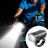 Mandotos International super bright LED bicycle front light with mounting bracket for night riding visibility and safety.