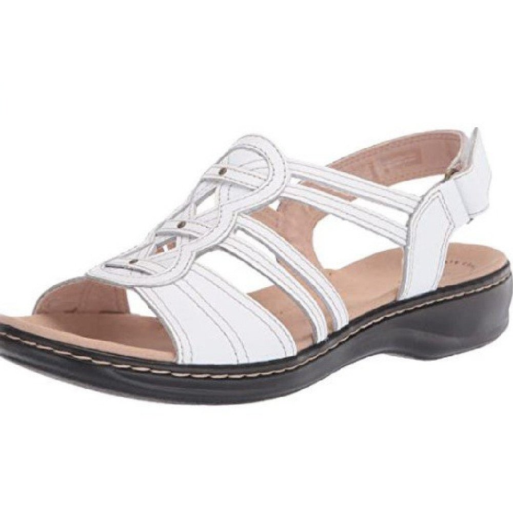 Trendy women's beach sandals by MANDOTOS INTERNATIONAL featuring colorful straps and comfortable flat soles.