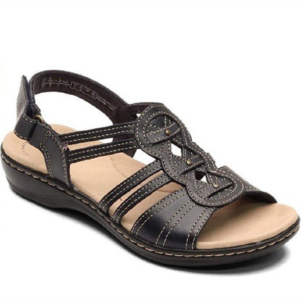 Trendy women's beach sandals from MANDOTOS INTERNATIONAL featuring colorful straps and comfortable flat soles.