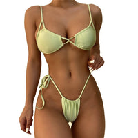 Unique design thong bikini by MANDOTOS INTERNATIONAL featuring lace-up detail, ideal for beachwear and women's 2-piece swimsuits.
