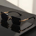 Unisex luxury frameless black and gold sunglasses with leopard print, UV400 protection, thin rectangular lenses, elegant design.
