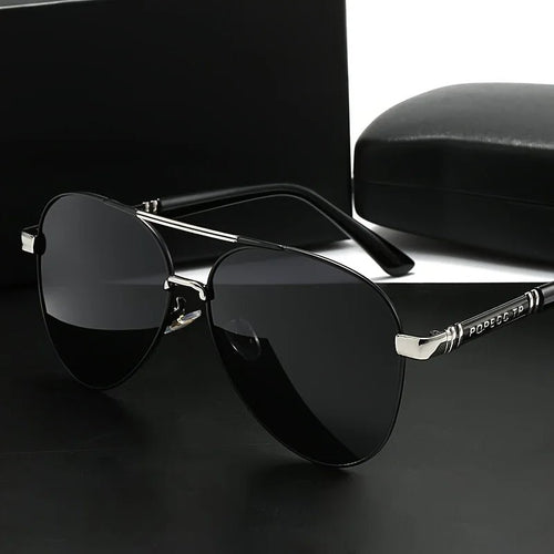 Unisex polarized stylish eyewear by MANDOTOS INTERNATIONAL, suitable for travel and driving, with sleek design and tinted lenses.
