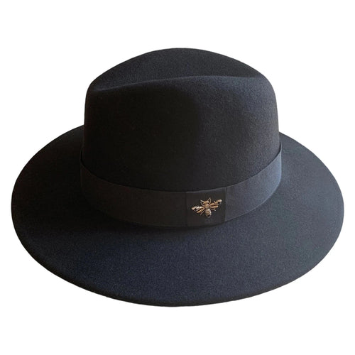 Vintage wool fedora with feather band by MANDOTOS INTERNATIONAL, ideal for formal events and weddings.