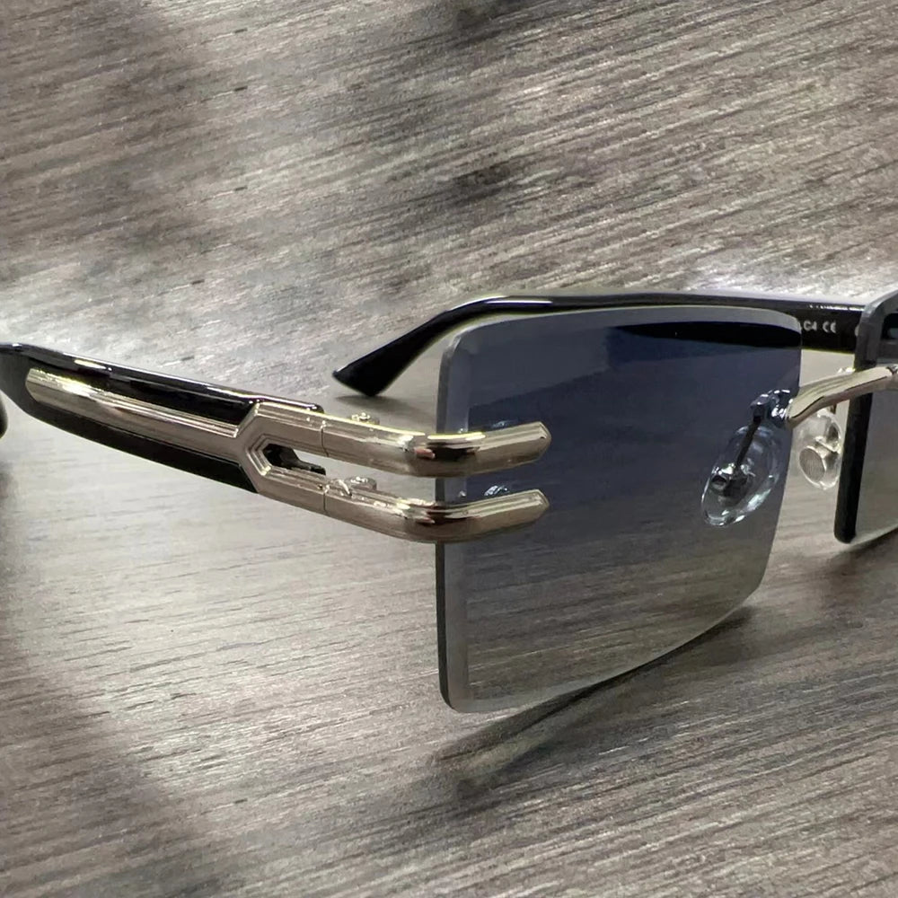 Vintage rimless sunglasses with stylish PC frames by Mandotos International, showcasing sleek and modern eyewear design.