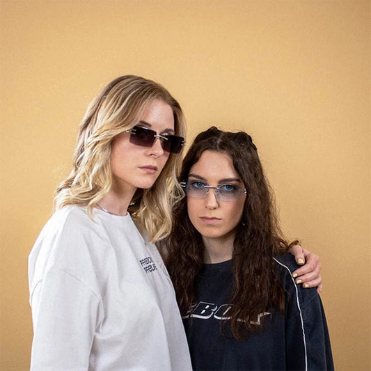 Vintage rimless sunglasses with stylish PC frames by MANDOTOS INTERNATIONAL, showcasing sleek, modern eyewear design.