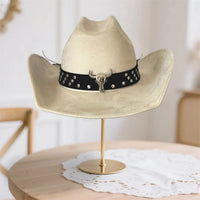 Vintage unisex cowboy hat with wide brim, bull head bead detail, by MANDOTOS INTERNATIONAL, stylish and rugged fashion accessory.