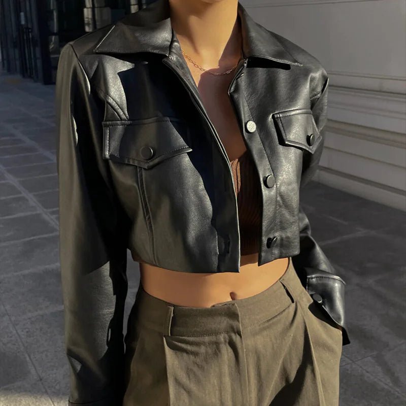 Mandotos International Vogue PU cropped jacket in black, featuring a stylish, fitted design with a collar and button closure.