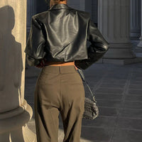 Mandotos International Vogue PU cropped jacket featuring a stylish design and fitted silhouette on a plain background.