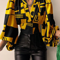 Women's blouse with V-neck, lantern sleeves, solid color, loose fit, casual streetwear style, by MANDOTOS INTERNATIONAL.