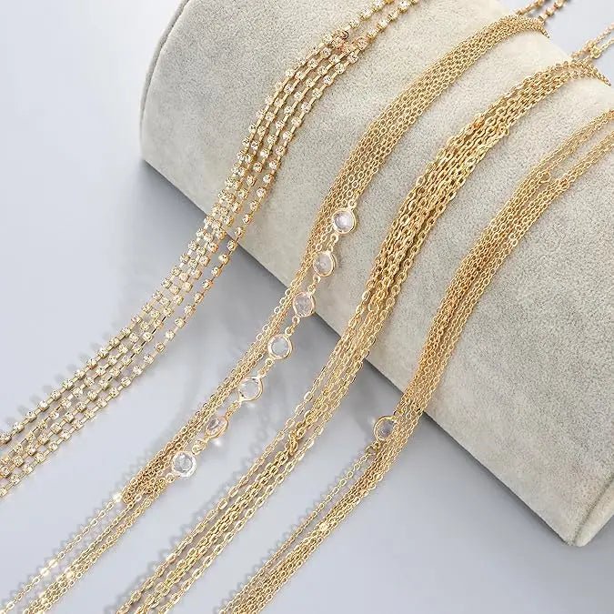 Women's gold body chain necklace bikini jewelry set with four pieces, featuring delicate chains and stylish design.