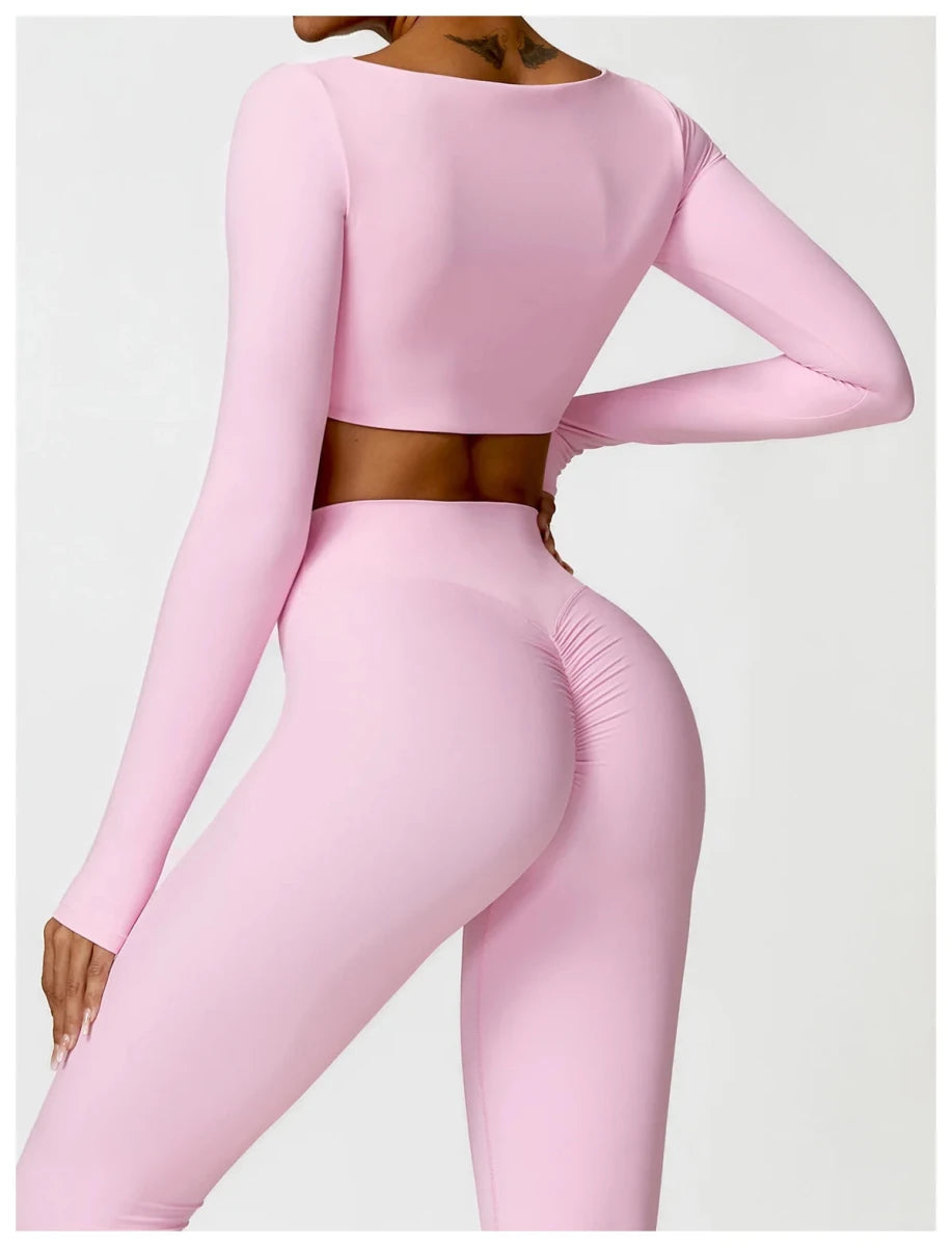 Women's long sleeve fitness T-shirt from MANDOTOS INTERNATIONAL, gym-ready push-up top for active wear.
