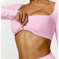 Women's long sleeve fitness T-shirt from MANDOTOS INTERNATIONAL, designed for gym workouts and push-up support.