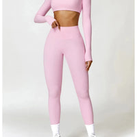 Women's long sleeve fitness T-shirt by MANDOTOS INTERNATIONAL, gym push-up top with fitted design and comfortable fabric.