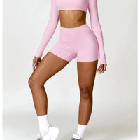 Women's long sleeve fitness T-shirt by MANDOTOS INTERNATIONAL, gym push-up top designed for activewear and workout comfort.