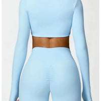 Women's long sleeve fitness T-shirt by MANDOTOS INTERNATIONAL, gym push-up top, comfortable athletic wear for women.