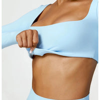 Women's long sleeve fitness T-shirt by MANDOTOS INTERNATIONAL, designed for gym workouts and push-up support.