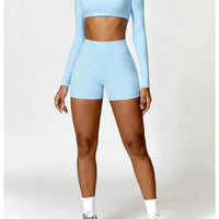 Women's long sleeve fitness T-shirt by MANDOTOS INTERNATIONAL, gym-ready push-up top with comfortable, stretchy fabric for active wear.