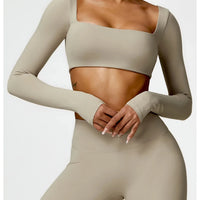 Women's long sleeve fitness T-shirt by MANDOTOS INTERNATIONAL, gym push-up top, athletic wear for active workouts.